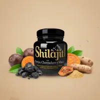 Shilajit líquido con borojó con sus ingredientes naturales alrededor